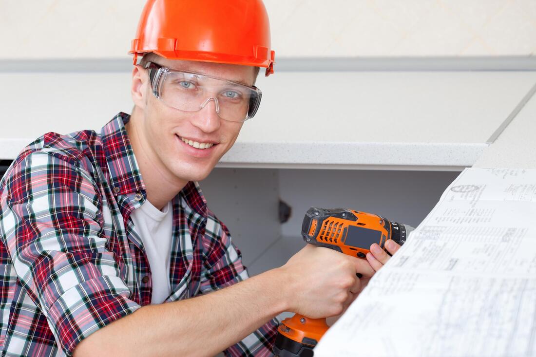 worker using a driller